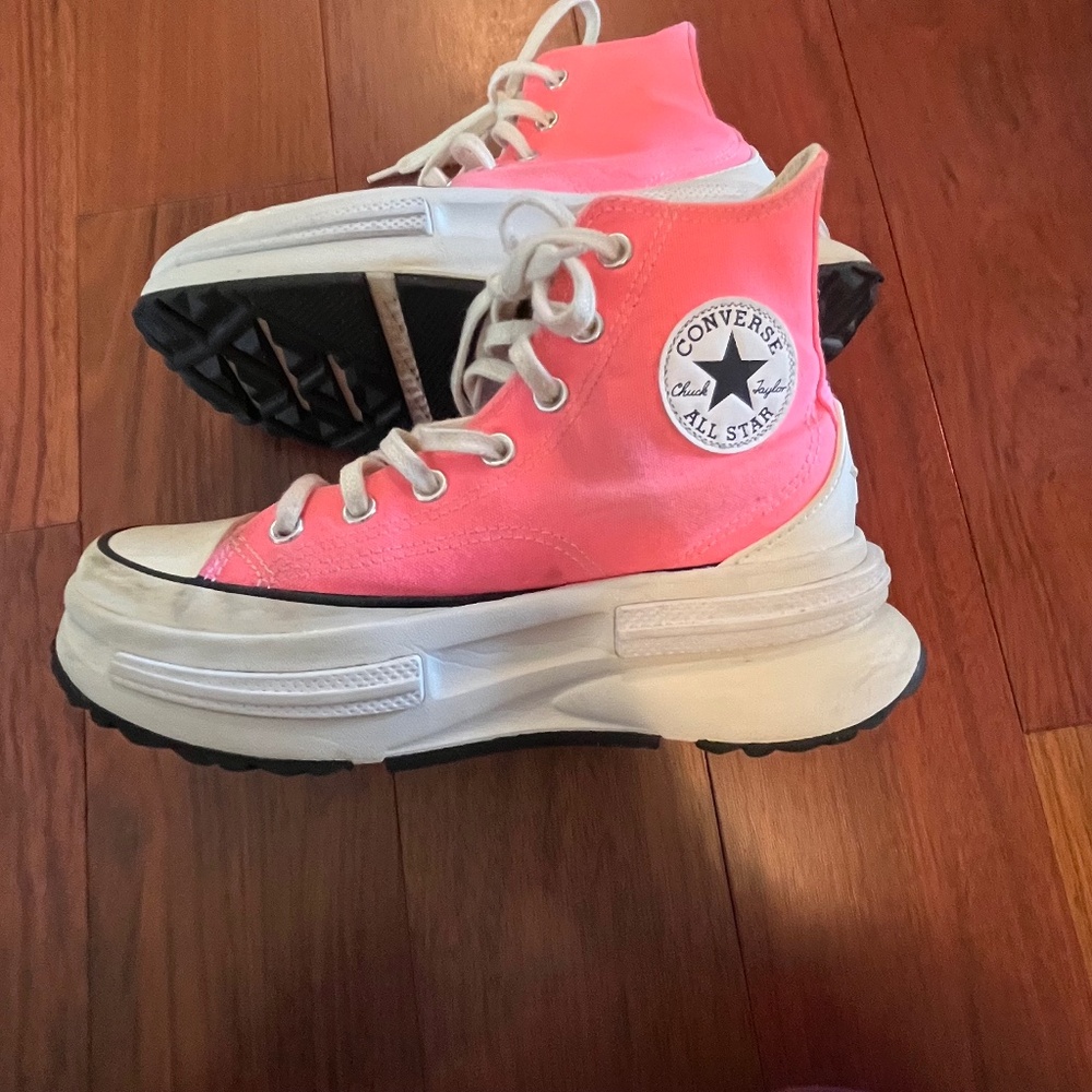 neon/bright pink legacy run star converse
